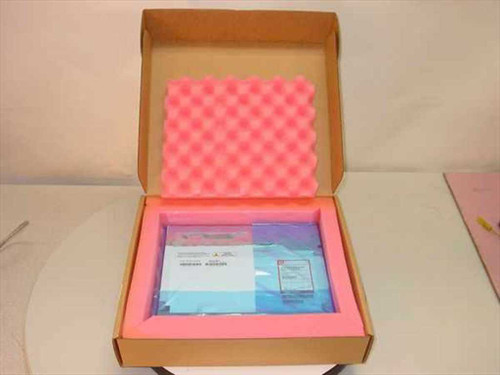 Sharp LQ141X1LH23 14.1-inch TFT LCD screen in anti-static bag, nested in pink foam inside open cardboard shipping box