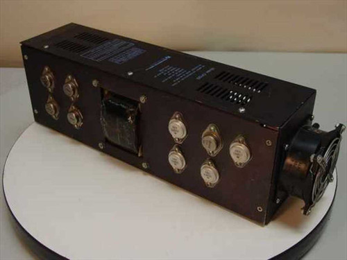 Microcomputer Power CP129 power supply – side view showing output transistors, transformer, and attached cooling fan with cracked housing
