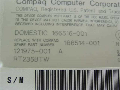 Compaq keyboard bottom label showing part numbers 166514-001, 121975-001, RT235BTW and FCC compliance information