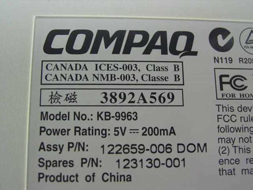 Compaq KB-9963 bottom label showing model number, part number 123130-001, assembly P/N 122659-006, and 5V 200mA power rating