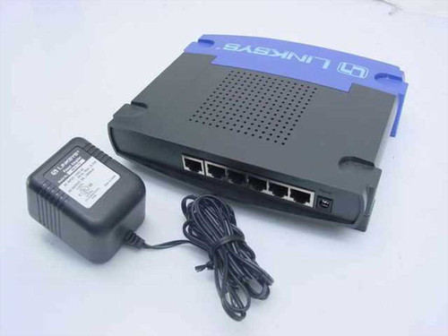 Linksys BEFSR41 router – rear panel showing 4 LAN ports, WAN port, uplink, and power jack with included AC adapter