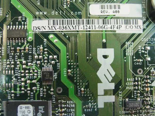 Dell MX-036XMT label close-up showing part number DS/N MX-036XMT-12411-06G-4F4P and REV A00 sticker