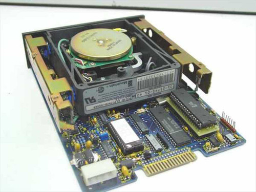 Mountain 01-05740-01 tape drive with cover removed showing internal mechanism, circuit board, drive motor, and SCSI interface connector