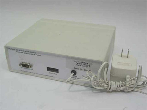 Multimon Multi-Interface Unit rear panel showing DB9 UPS connection port, bridging header, and external power adapter connected