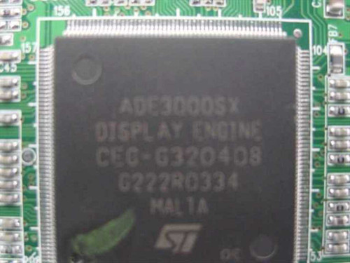 Close-up of ST ADE3000SX Display Engine main chip showing markings CEG-G320408 and STMicroelectronics ST logo