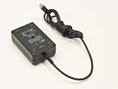 Ault SW305 AC adapter top-angle view showing black plastic housing, coiled output cable with 6-pin connector, and IEC AC inlet