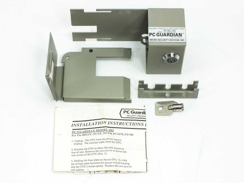 PC Guardian Model 203 complete kit laid out: lock housing, base plate, mounting brackets, key, and installation instructions