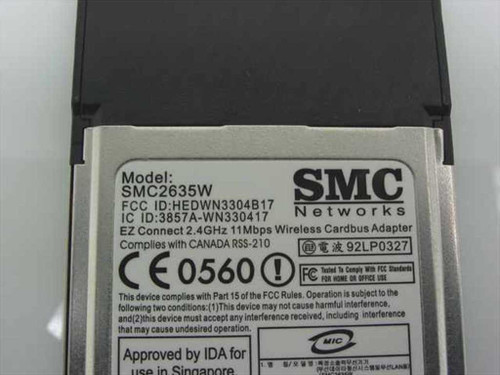 SMC Networks SMC2635W — rear label showing FCC ID HEDWN3304B17, IC ID, CE 0560 mark, and regulatory compliance text