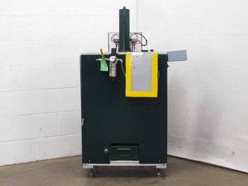 Custom blind rivet station front view — dark green enclosed cabinet with SMC filter/regulator mounted on side panel and yellow safety guard at top right