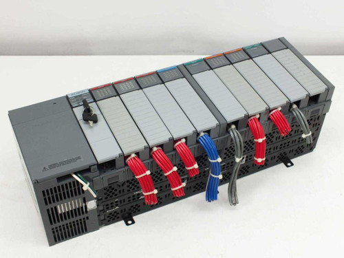 Allen-Bradley 1746-A10 SLC 500 10-slot PLC rack front view showing all modules installed with color-coded field wiring harnesses