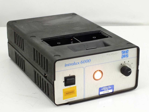 Volpi Intralux 6000 fiber optic light source – front panel view showing power switch, illuminated output indicator, and control knob with lamp cover missing