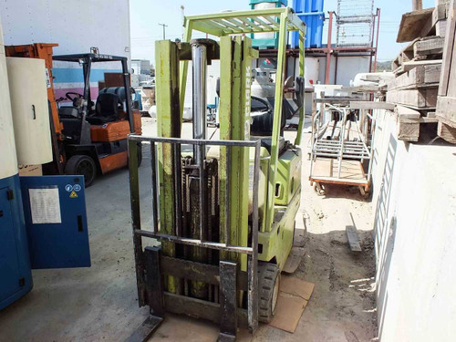 Clark C500-30 forklift – front three-quarter view showing duplex mast, forks, and cushion tires indoors