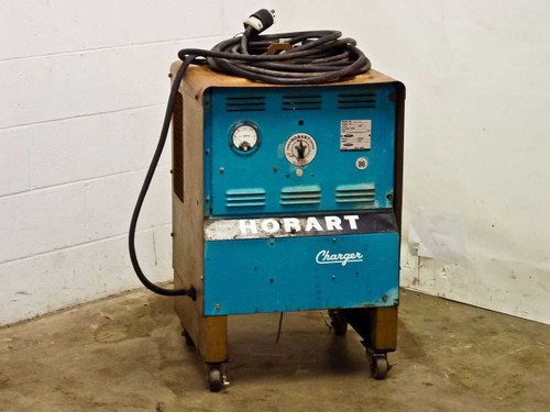 Hobart 1R6-504 industrial battery charger front view showing teal cabinet, DC ammeter gauge, timer dial, and Hobart Charger nameplate on casters