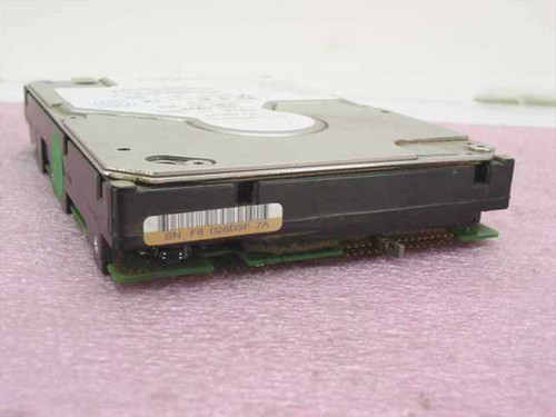 IBM 09L3906 18.2GB SCSI hard drive — side and rear view showing drive PCB and serial number label