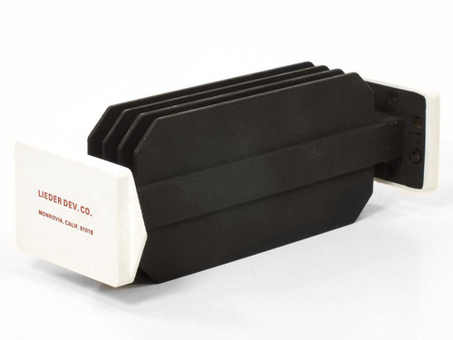 Varian F137CA2 WR-137 waveguide — rear three-quarter view showing finned body and white rectangular flanges; Lieder Dev. Co. Monrovia CA label visible on flange