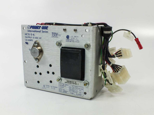 Power-One HC15-3-A International Series power supply – front panel showing model label, TUV certification, UL mark, and output wire harness