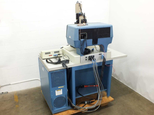 Hughes Model 2500 Hybrid Die Bonder right-side view showing card cage cabinet, external controller unit, and interconnect cabling on pallet