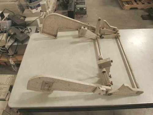 Kodak Versamat Roll Feed Adapter Model 11C — full unit overview showing frame, arm, and adjustable stand on worktable