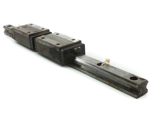 THK YN8F1-A linear guide rail, 52cm long, with two block carriages mounted — full side view showing rail and carriage assembly