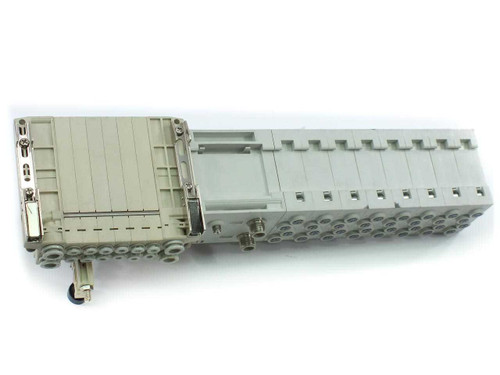 SMC SS5V1 manifold base with SV1200-5FU solenoid valves — bottom and rear view showing pneumatic port array