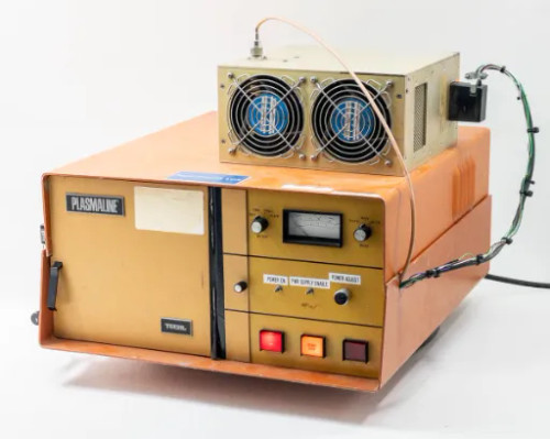 Tegal PlasmaLine 200 Plasma Barrel Etcher front-right three-quarter view with Comdel CPS-200AX RF power supply mounted on top, dual cooling fans visible