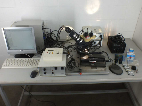 Finetech Fineplacer PCB rework station full system overview on workbench with Leica MZ6 microscope, PC, monitor, keyboard, controllers, and accessories