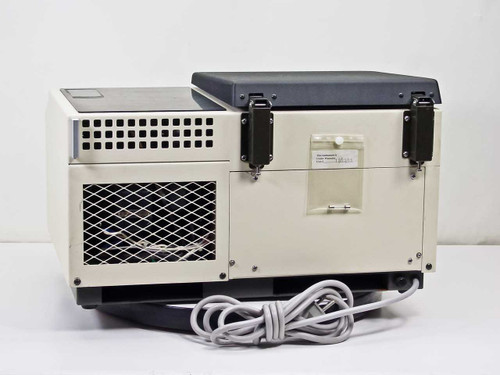 Tomy Seiko MTX-150 Refrigerated Micro Centrifuge rear view showing ventilation grille, refrigeration compressor exhaust, lid latches, and attached power cord