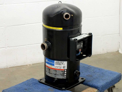 Copeland ZR19M3-TWD-561 scroll compressor front view showing data label, suction and discharge ports, and open electrical box