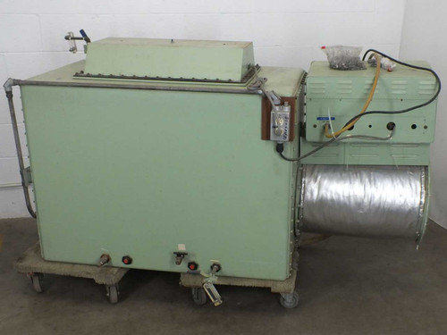 Vacuum Atmospheres VAC glove box – left rear and back view showing green painted enclosure body on casters and insulated ductwork on right side