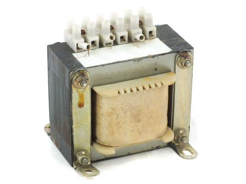 Open frame laminated core power transformer front view showing EI core, mounting feet, and multi-tap screw terminal block on top