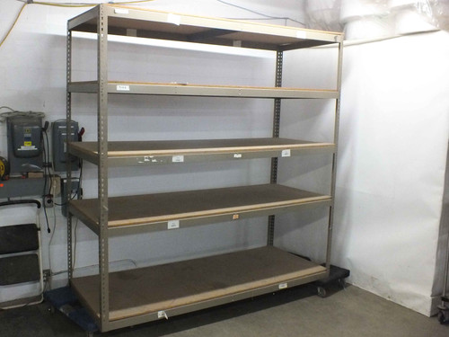 Heavy duty boltless rivet shelving unit 96x36x96 with 5 particle board shelves — full front view in warehouse setting