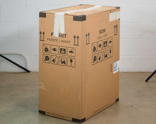 U-Line UHCP115-BS01A clear ice machine shipping box — front and side panels with handling symbols