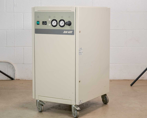 Jun-Air 2000-25M oil-free cabinet air compressor – three-quarter front-left view showing enclosed cream cabinet with casters