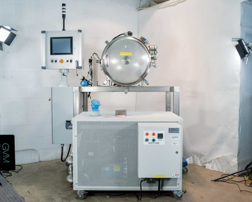 Opti Temp OTC-3.0AL full system overview — vacuum chamber on steel frame above integrated chiller unit with NI touchscreen control panel mounted to left