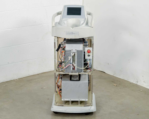 Lumenis LightSheer XC laser system – front view showing open chassis, internal boards, red emergency stop button, and touchscreen display