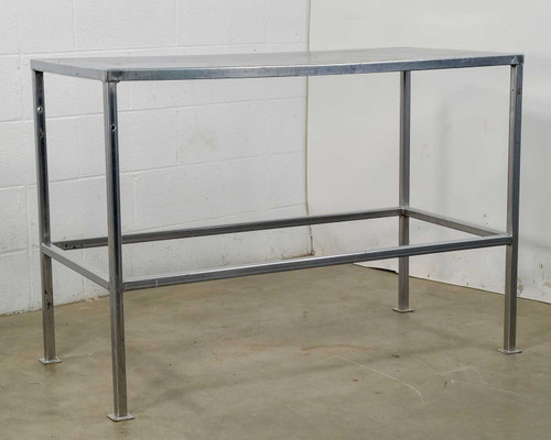 Steel workbench table with stainless top and open lower rail – front three-quarter view