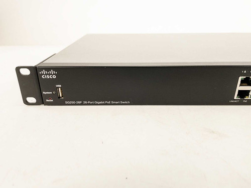 Cisco SG250-26P front panel close-up showing USB port, System LED, Reset button, SFP uplink ports, and model label