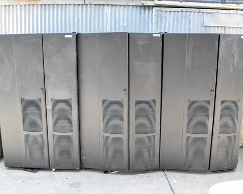 Eaton 9395 Series 1085 battery cabinets – front view of three closed floor-standing units outdoors