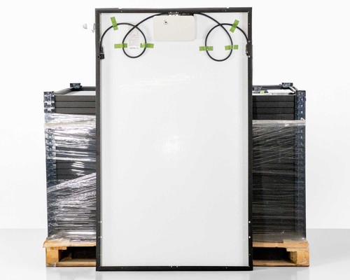 LG LG370M1K-A6 NeON 2 Black solar panel rear view showing white backsheet, integrated LG microinverter housing at top center, and black AC output cables taped in loops