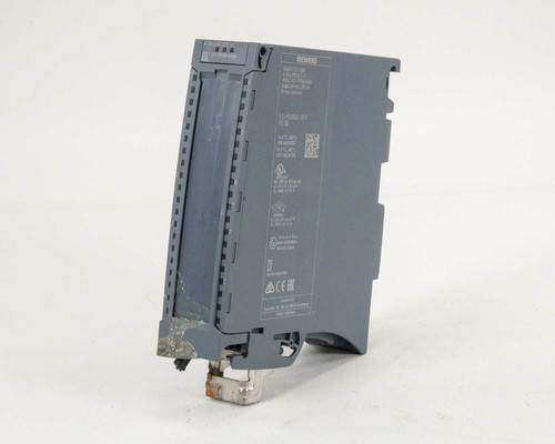 Siemens 6ES7531-7KF00-0AB0 S7-1500 Analog Input Module – angled front-left view showing label and DIN rail clip with visible corrosion on clip
