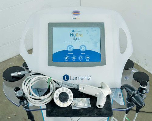 Lumenis NuEra Tight APMD130 front panel with touchscreen displaying home screen and handsets on tray