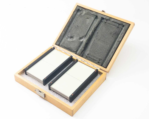 Optical Engineering laser beam dump set — two absorptive panels seated in open wooden carry case with foam lining