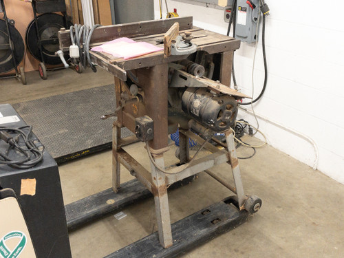 Walker-Turner table saw – rear and side view showing belt drive motor assembly and metal stand with wheels