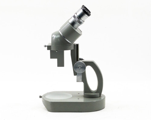 Elgeet No. 56896 stereo microscope right-side profile view showing arm, focus knob, and base with stage disc