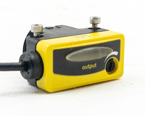 Banner QS30D sensor emitter face and side view showing red infrared LED lens, mounting studs, and output indicator symbols