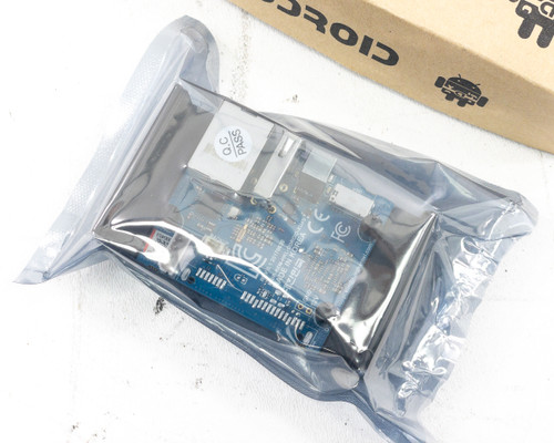 ODROID-MC1 Solo PCB visible through antistatic bag showing blue board with Gigabit Ethernet and USB ports, QC PASS sticker