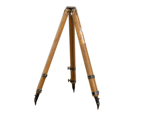 Vintage wooden surveying tripod legs fully extended, front view showing three hardwood legs with metal hardware and steel ground spikes