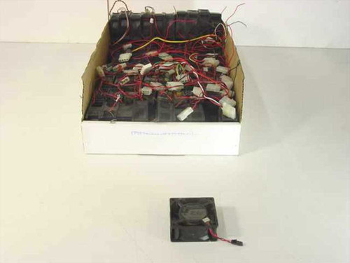Box of multiple small DC brushless cooling fans with red and black wire leads, one fan displayed separately in front