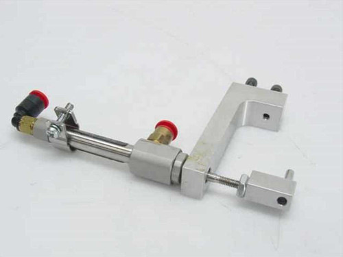 SMC NCDJ2L6-050R-H7A1LS pneumatic cylinder assembly showing full bracket, brass push-in fittings, and solenoid valves from alternate angle