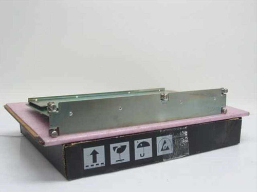 CTI 1003-55417 Base Quad PCB module resting on anti-static foam pad inside original box, side profile view showing metal bracket and green PCB edge